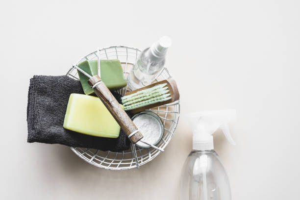 istock Cleaning utensils, a soap and a brush in a basket 1310872995