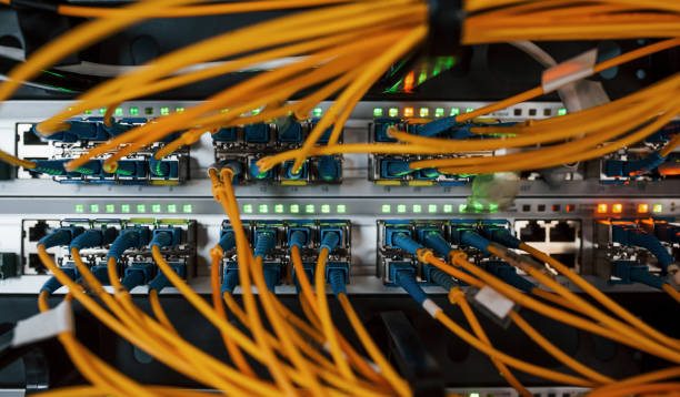 istock Close up view of internet equipment and cables in the server room 1310873010