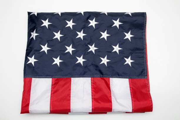 istock USA flag folded on white background. American flag folded on white background. Memorial day concept. 1310874266