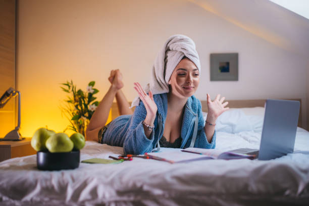 istock Woman working from home in bed during the quarantine 1310875275