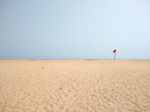 Red flag on the beach, seascape view, Poovar Thiruvananthapuram Kerala