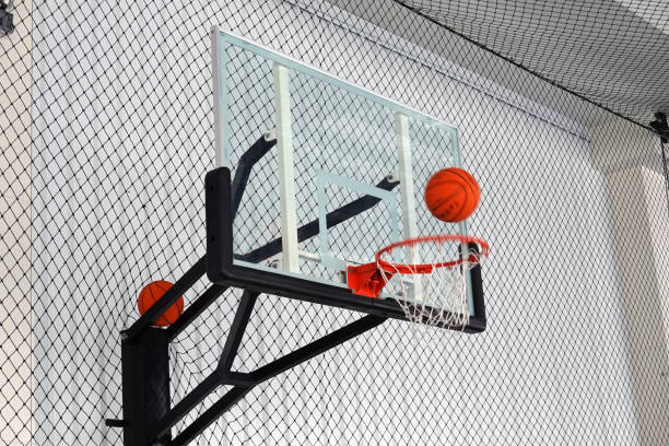 istock Basketball basket and ball in movement, net background. 1310877044
