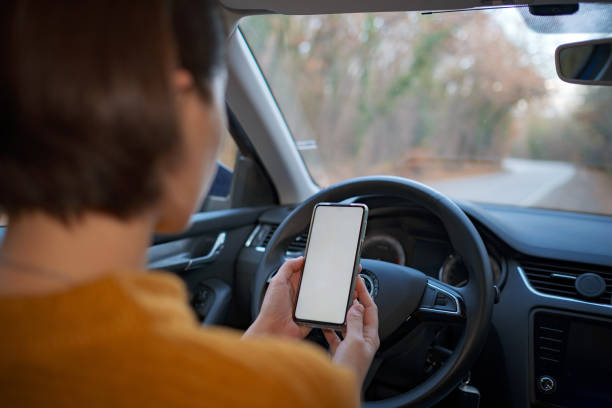 istock Mockup image of a woman holding and using mobile phone 1310877894