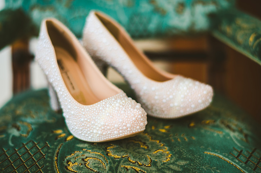 High heels wedding shoes decorated with pearls