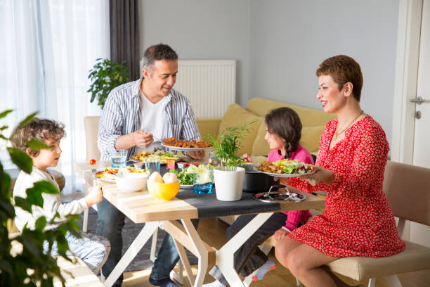 istock Young family having meal together 1310882267
