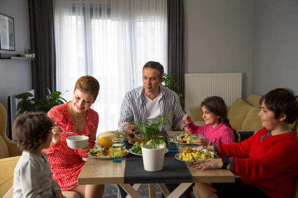istock Young family having meal together 1310882270