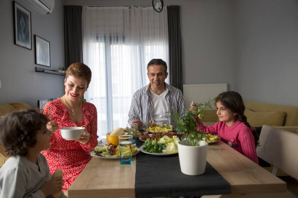 istock Young family having meal together 1310882273