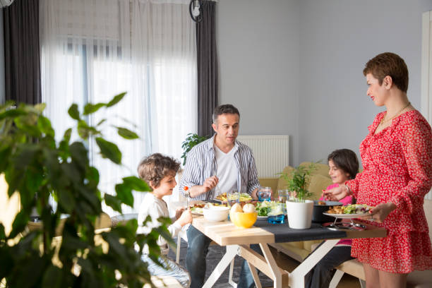 istock Young family having meal together 1310882314
