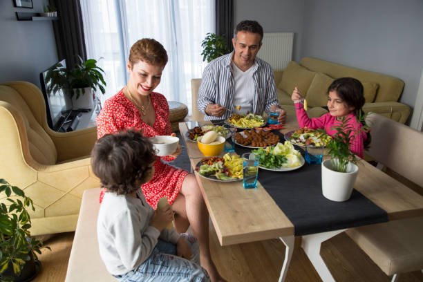 istock Young family having meal together 1310882318