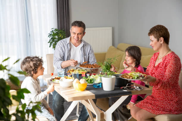 istock Young family having meal together 1310882349