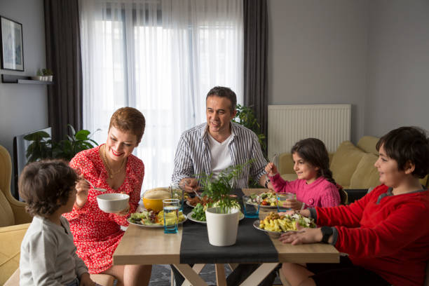 istock Young family having meal together 1310882350