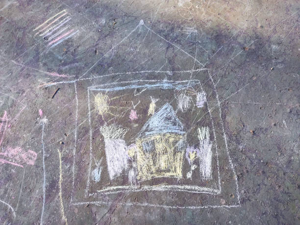 istock drawing of house painted with chalks on asphalt 1310885715