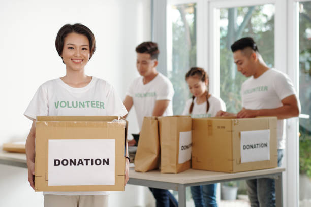 istock Woman working at donation center 1310888633