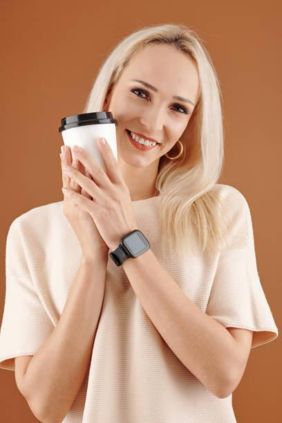 istock Young woman with coffee cup 1310889587