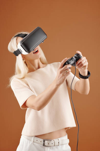 istock Woman enjoying videogame 1310889596