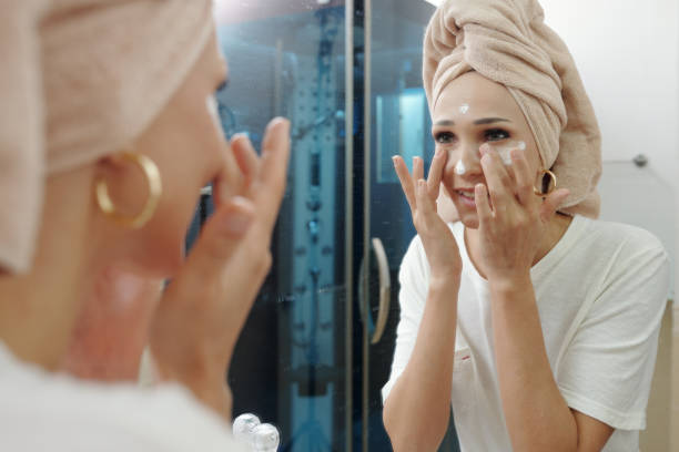 istock Woman applying anti-aging moisturizer 1310889637