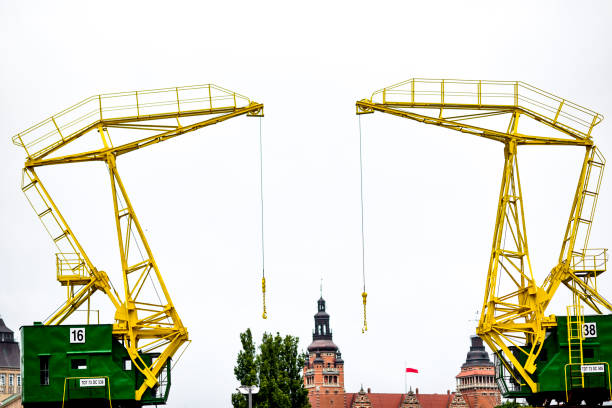 historic harbor cranes for the buildings of szczecin - industry szczecin europe nautical vessel imagens e fotografias de stock