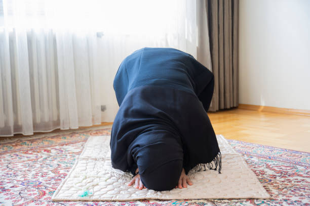istock the young muslim woman is praying. 1310892932