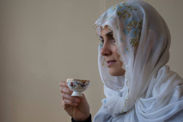 istock Wearing an embroidered headscarf, the woman drinks her coffee 1310892996