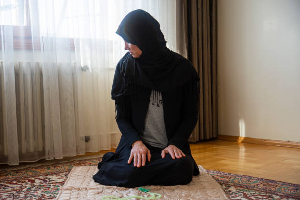 istock the young muslim woman is praying. 1310893048
