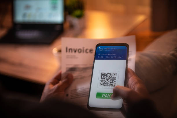 istock Mobile phone with QR pay app 1310893112