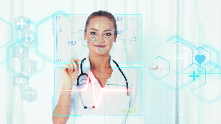 Young female doctor standing and pressing modern medical type of buttons