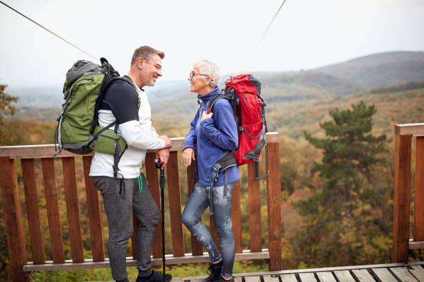 istock Senior hikers couple looking at etch other 1310893167