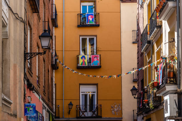 Madrid, Spain - January 31, 2021: Decorated Balconies in Lavapies Quarter in a Tribute to the Neighbourhood by Artist Paula Moscuzza