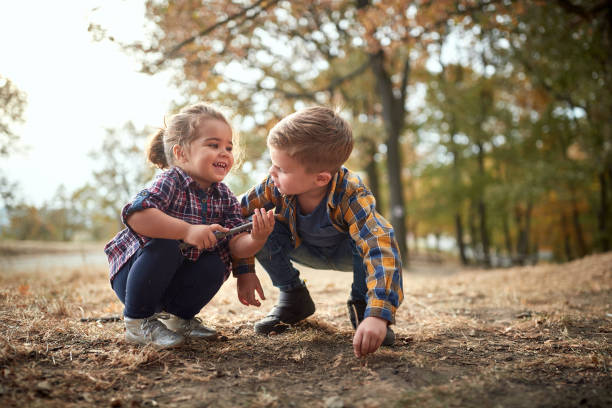 istock Little children playing outdoor 1310897699