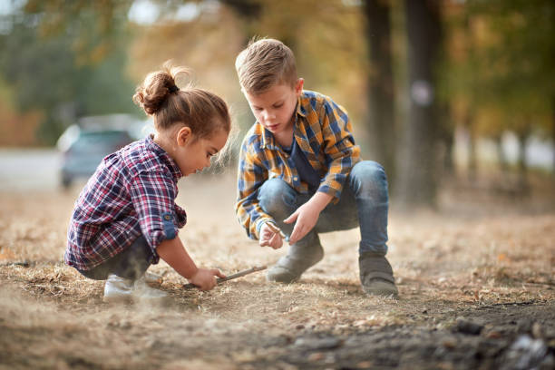 istock Brother and sister playing outdoor 1310897747
