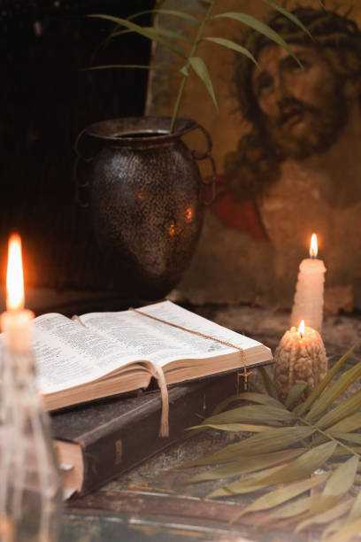 istock candles, paited eggs, willow branches and bible. vintage icon. easter at home 1310900049