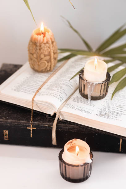 istock Easter evening with palm leaves, candles and bible next to the icon, Easter theme 1310900064