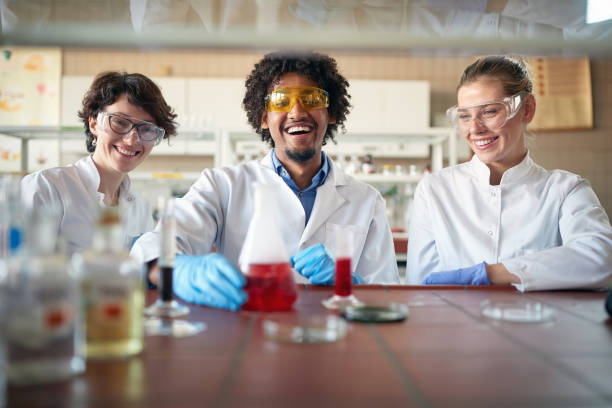 istock Young chemistry students have fun working with chemicals in the university laboratory. Science, chemistry, lab, people 1310902325