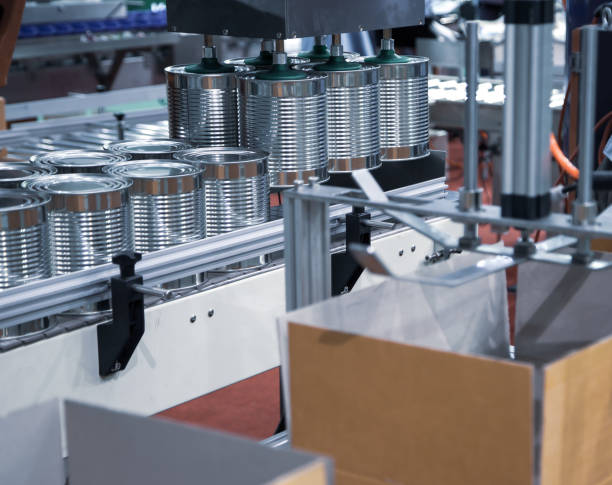 istock Robot lifting food can into cardboard 1310902574