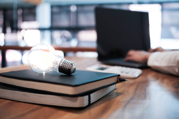 istock Creative idea Business women holding light bulbs Concept of idea technology and creativity 1310905107