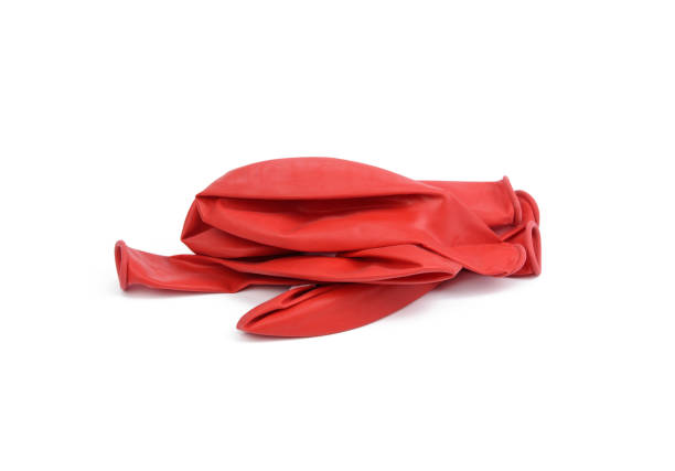 istock pile of deflated rubber red balls isolated on white background 1310905127