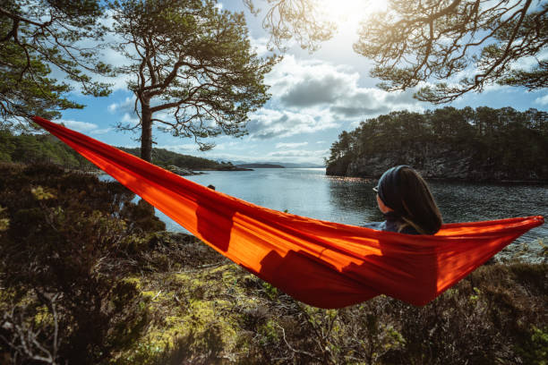 istock Springtime in Norway: adventures in nature outdoor on hammock 1310906820