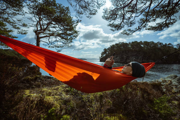 istock Springtime in Norway: adventures in nature outdoor on hammock 1310906862