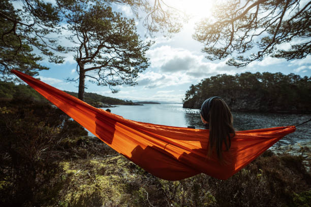 istock Springtime in Norway: adventures in nature outdoor on hammock 1310906895