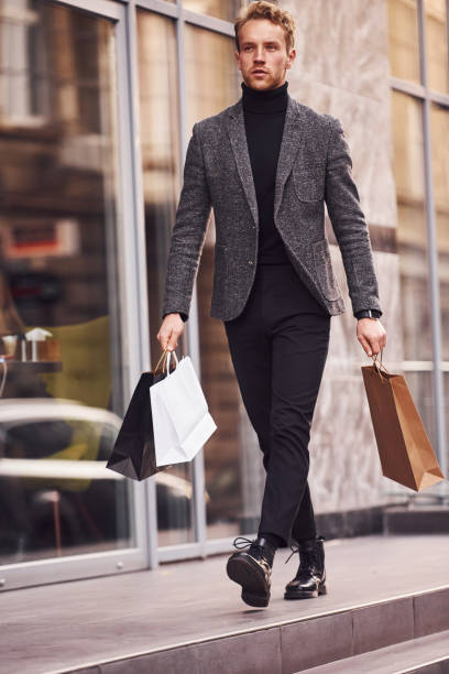 23,400+ Young Man Shopping Bag Stock Photos, Pictures & Royalty-Free ...
