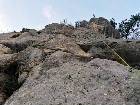 a rock with ropes to climb on it