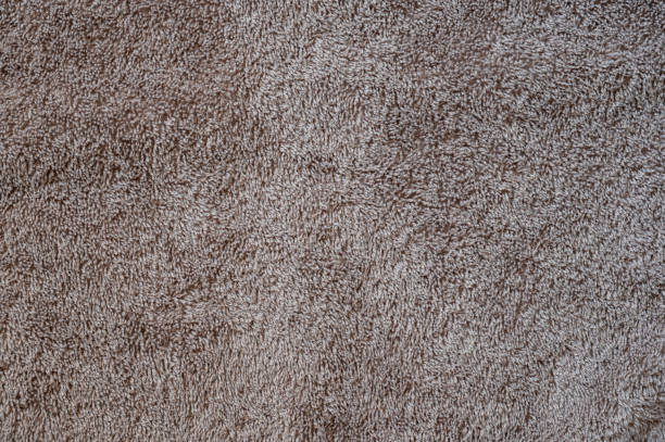 istock Texture of a grey brown towel. Fabric background. 1310911458