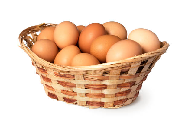 istock Chicken eggs in basket Isolated on white background. close up 1310911612