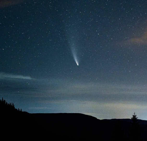 istock Snapshot of comet in clear starry summer sky 1310912166