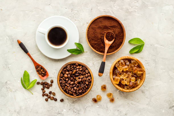 istock Coffee background. Coffee beans and hot drink, top view 1310916576