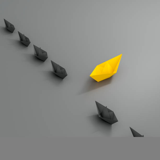istock Innovative business solution concept. Group of white paper ships in one direction and leading one red paper ship. 1310917763