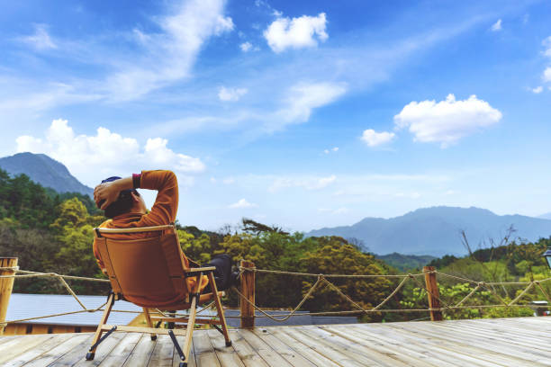 istock Traveler resting on a stool in an outdoor tent 1310920352