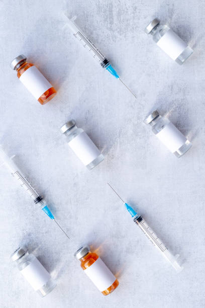 istock Coronavirus vaccine ampoules with syringe. Vaccination concept 1310921826