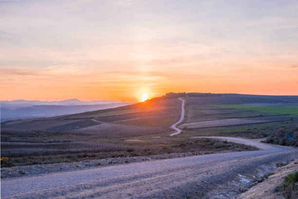 Landscape at the sunset with a road in the mountains