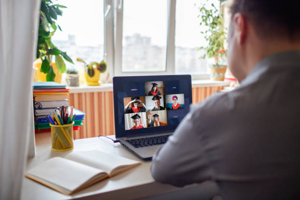 istock Virtual graduation ceremony. Students receiving congratulation from family during online video call 1310924821